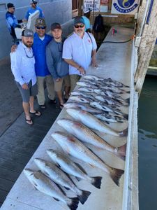 Group of people fishing at Galveston