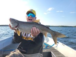 Angler with a large lake trout catch in Boulder Junction