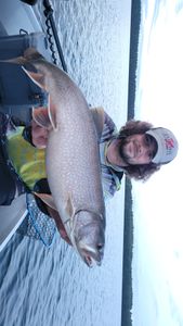 Photograph of a single brook trout, 36 inches long, caught while fishing in Boulder Junction