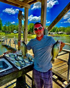 A person fishing for white crappie and crappie fish in TX