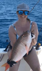 Angler posing with a 14-inch catch in FL