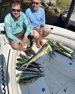 Two anglers fishing in Florida with 2 medium-sized fish caught