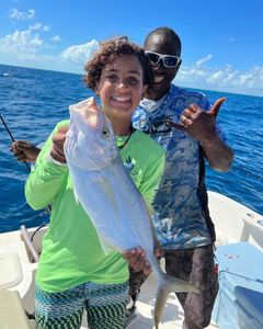 Anglers with a big fish on their line in Florida