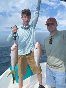 Two anglers fishing in FL with 2 big fish
