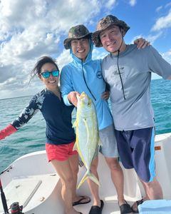 A group of 3 people fishing in the waters of Key Largo
