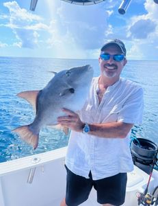 A lone fisherman reeling in a catch in the waters of Key Largo