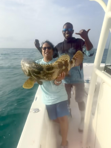 Reeling in a huge catch while deep sea fishing in the beautiful waters off Key Largo!