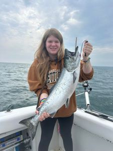 Successful angler with a big 28-inch fish in Olcott