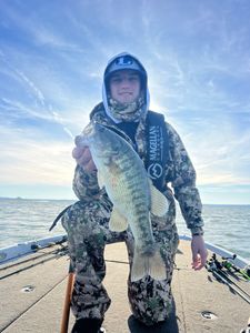 A fisherman with a Guadalupe Bass, a 22-inch freshwater fish, in TX