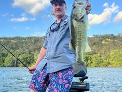 Angler with a largemouth bass at Buchanan Dam