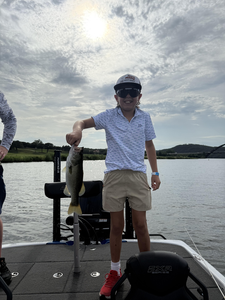 Reeling in a 14-inch Largemouth Bass at Buchanan Dam on a partly cloudy day!