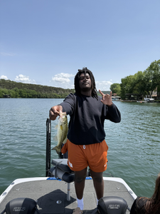 A 22-inch Largemouth Bass caught on a day with partly cloudy weather and rain clearing later.