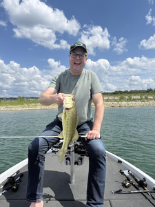 Hooked a feisty Largemouth Bass at the Buchanan Dam under partly cloudy skies!