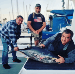 A group of 3 people fishing in Long Beach
