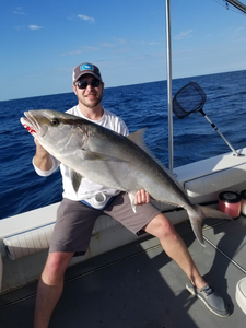 Angler with a large greater amberjack fish in FL