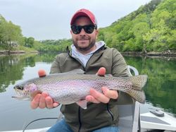 Angler with a beautiful rainbow trout, fishing in Missouri