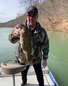 Fisherman with a freshly caught fish in Richland