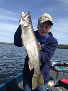 Angler holding a 28-inch fish in Phelps
