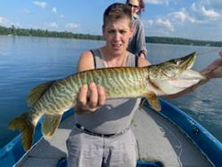Angler fishing on the shoreline in Phelps