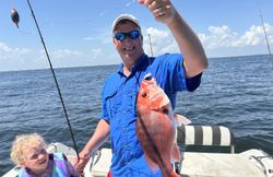 Two people fishing on the beach in Gulf Shores