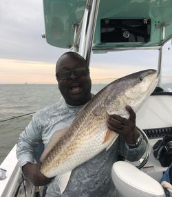 Angler fishing in the waters of Gulf Shores