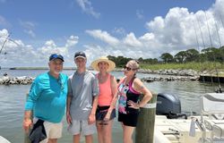Four friends enjoying a fishing trip in AL
