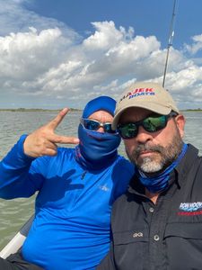 Two people fishing in TX
