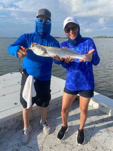 Two people fishing in TX