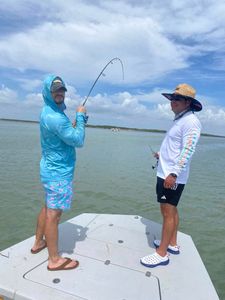 Two people fishing in Port Isabel