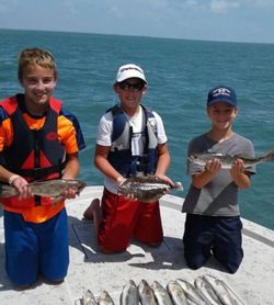 Three anglers fishing for an exciting catch in TX
