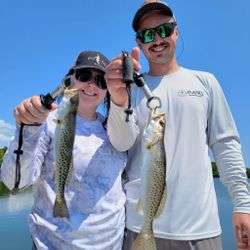Two spotted weakfish, 18 inches long, caught fishing in FL