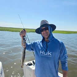 A fisherman with a spotted weakfish catch in Savannah