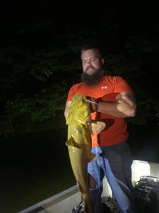 A person fishing in a cave spring location