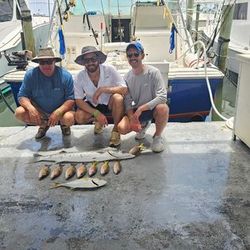 Three people enjoying a fishing trip in Islamorada