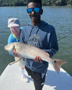 Anglers enjoying a fishing tour in Holmes Beach