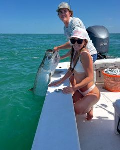 A couple enjoying a fishing tour in Holmes Beach