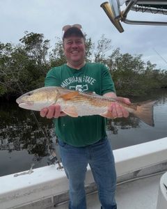 A lone fisherman casting his line in the waters of FL