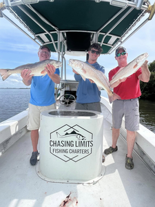 Two redfish, 25 inches long, caught while fishing in Holmes Beach, Florida