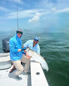 A tarpon fish being caught during a fishing tour in Holmes Beach