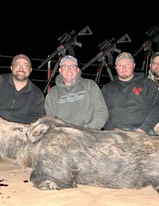 Four people enjoying a hunting trip in Archer City