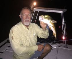 Two people fishing with one small fish in FL