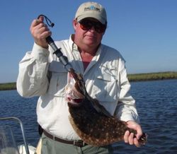 Angler holding a 13-inch fish in Florida