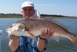 Angler holding a large redfish in FL