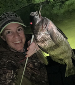 Angler with a black drum fish caught in Tampa, Florida