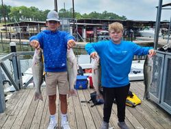 Two proud boys with their Striped Bass