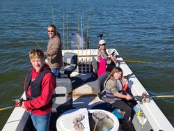 Four people fishing in OK location