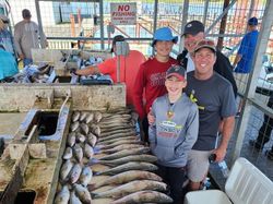 Four people fishing in OK location