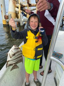 Fisherman with a 13-inch catch in Gulf Shores