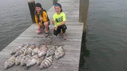 Two people fishing in the Gulf Shores
