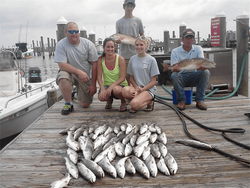 5 people fishing in the Gulf Shores